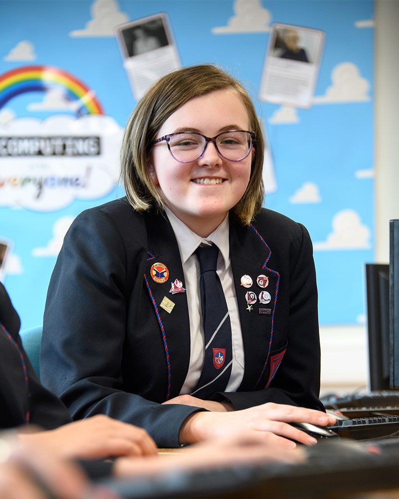 Girl in computer room smiling